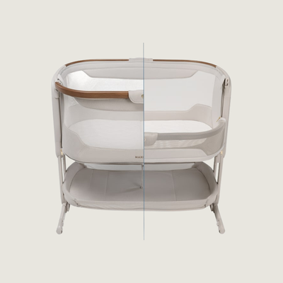 Maxi-Cosi Iora Pro co-sleeper tegen het ouderbed met geopend zijpaneel